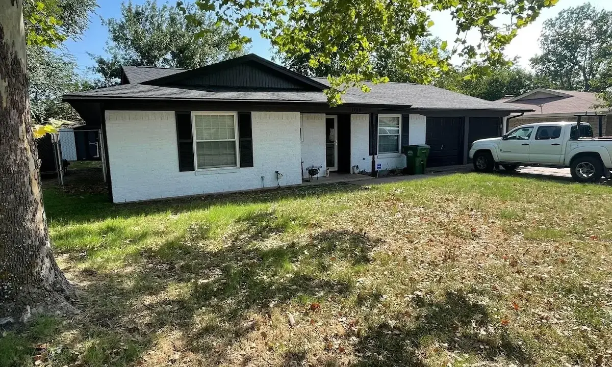 Professional roofing crew working on a residential roof in Medford